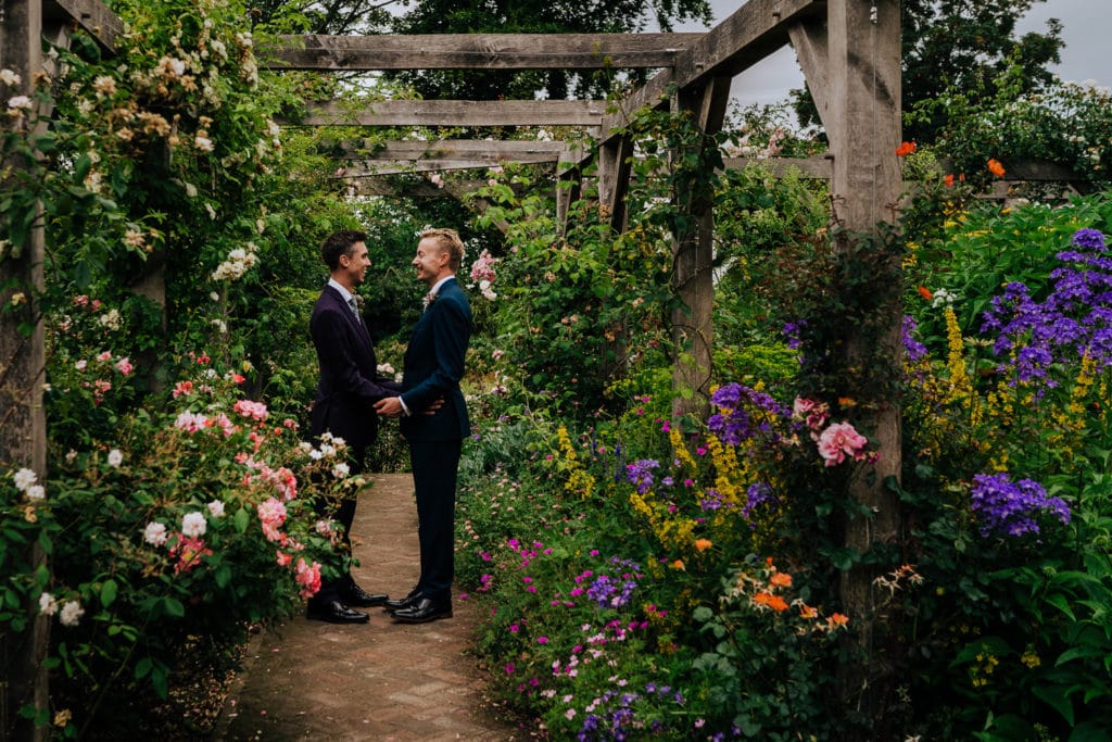 romantic photo of newlywed gay couple in Pembroke Lodge Gardens