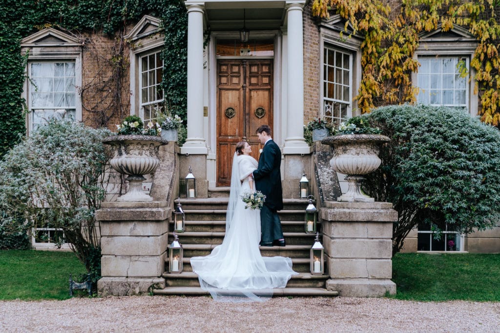 intimate portrait of bride and groom at Hampton Court House