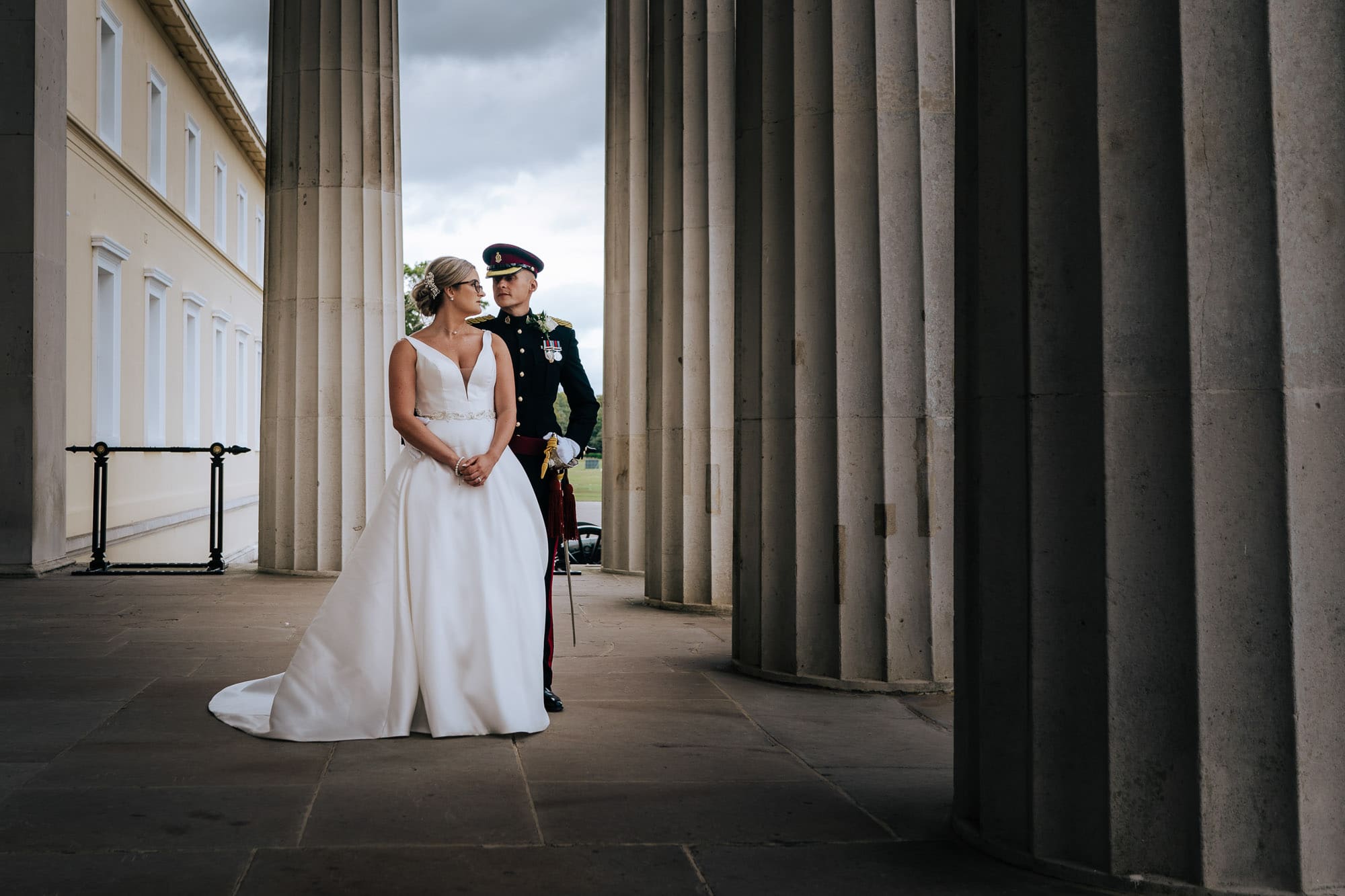 military wedding photographer captures Bride and groom on old college steps RMAS