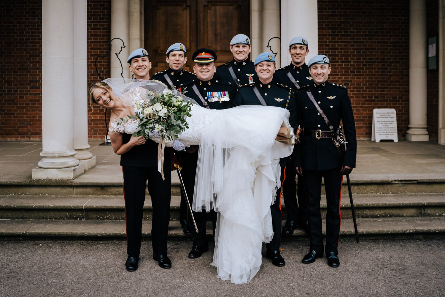 bride carried by guard of honour