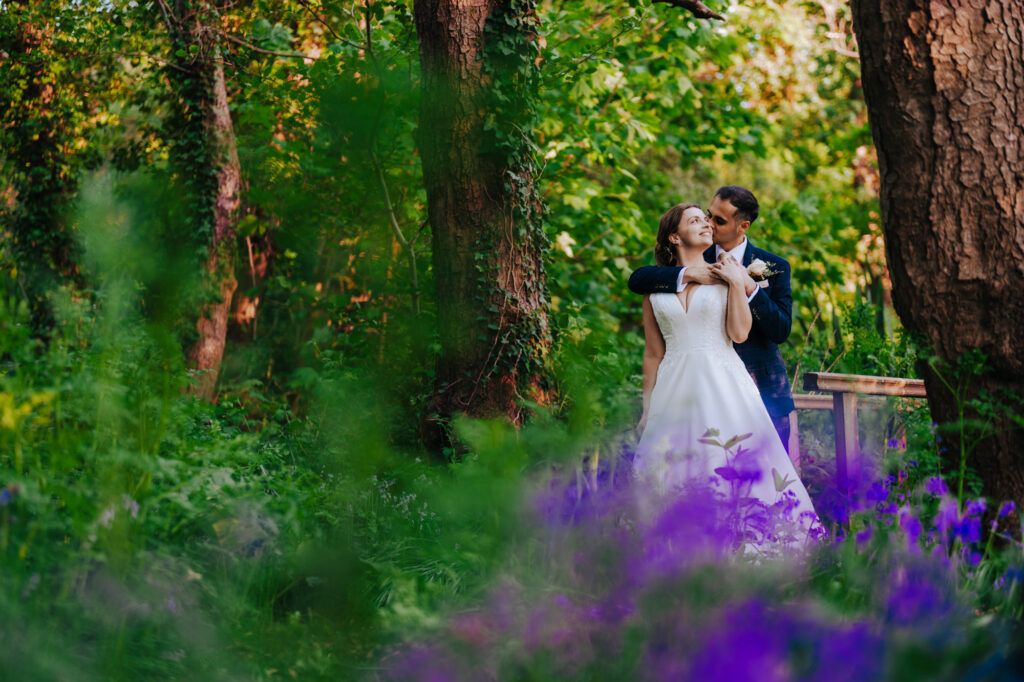 Bride and groom hugging together during couples poraitsin the UK