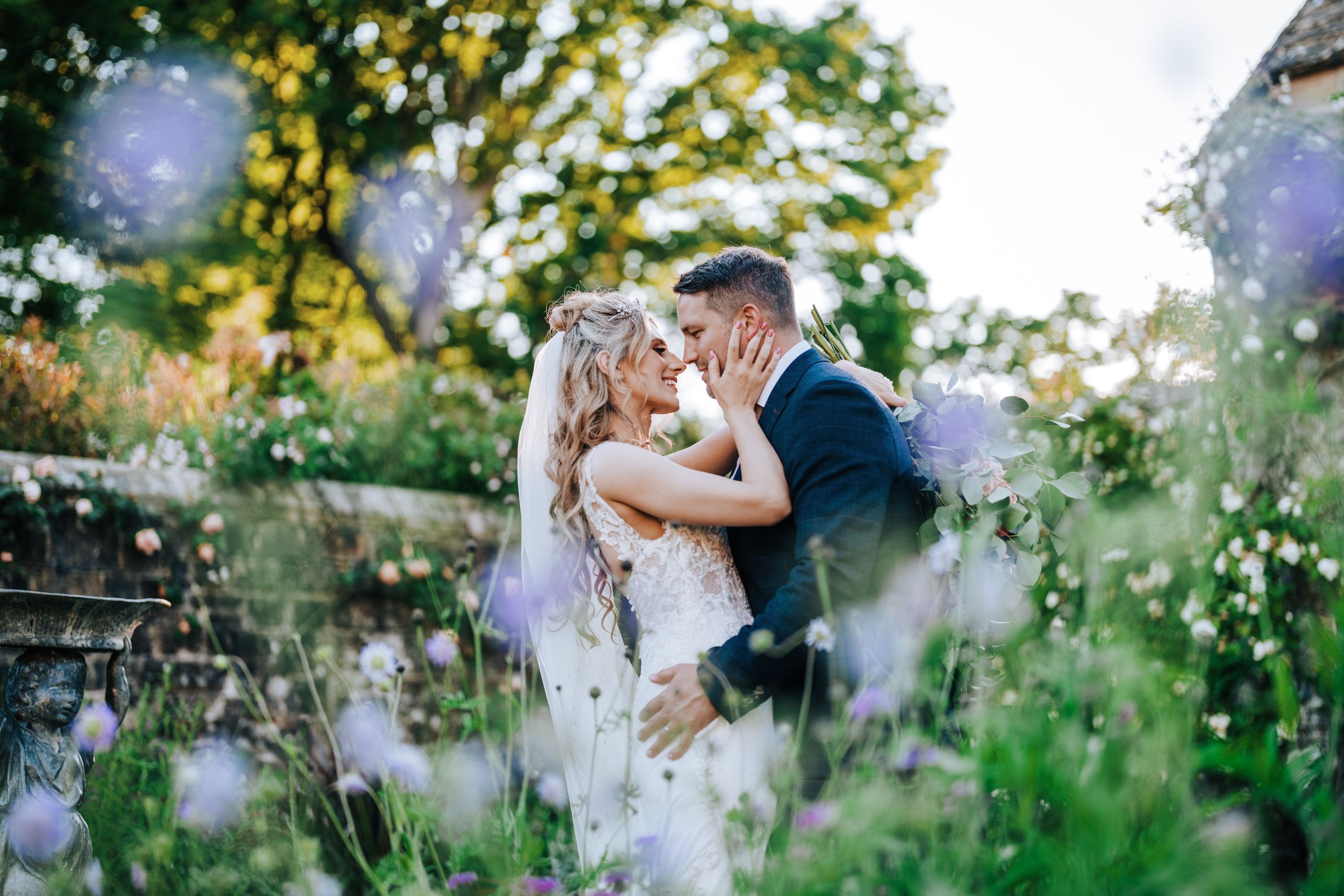 a couple pose in nymans NT captured by Sussex wedding photographer Alex Buckland