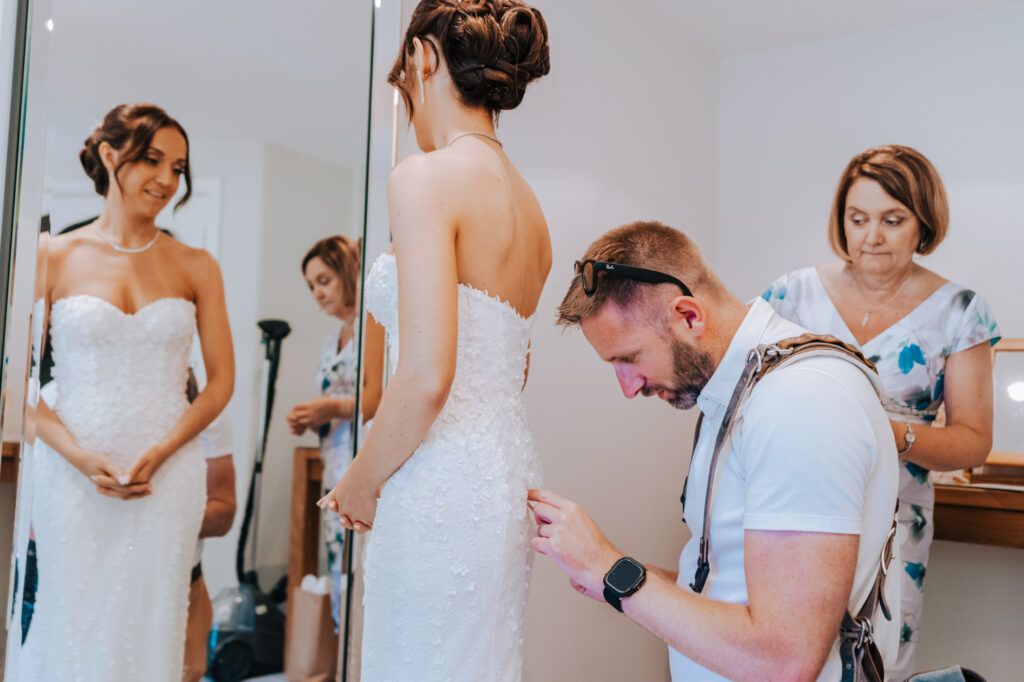Wedding photographer working discreetly during a UK wedding day