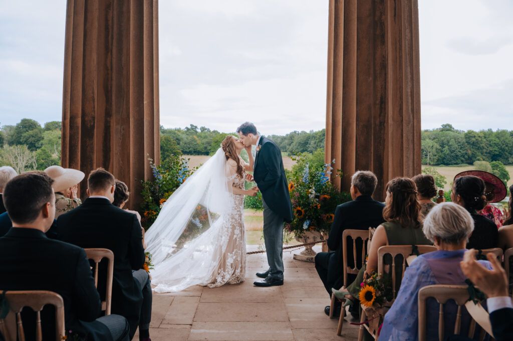 Guests watching a wedding ceremony during a UK wedding day