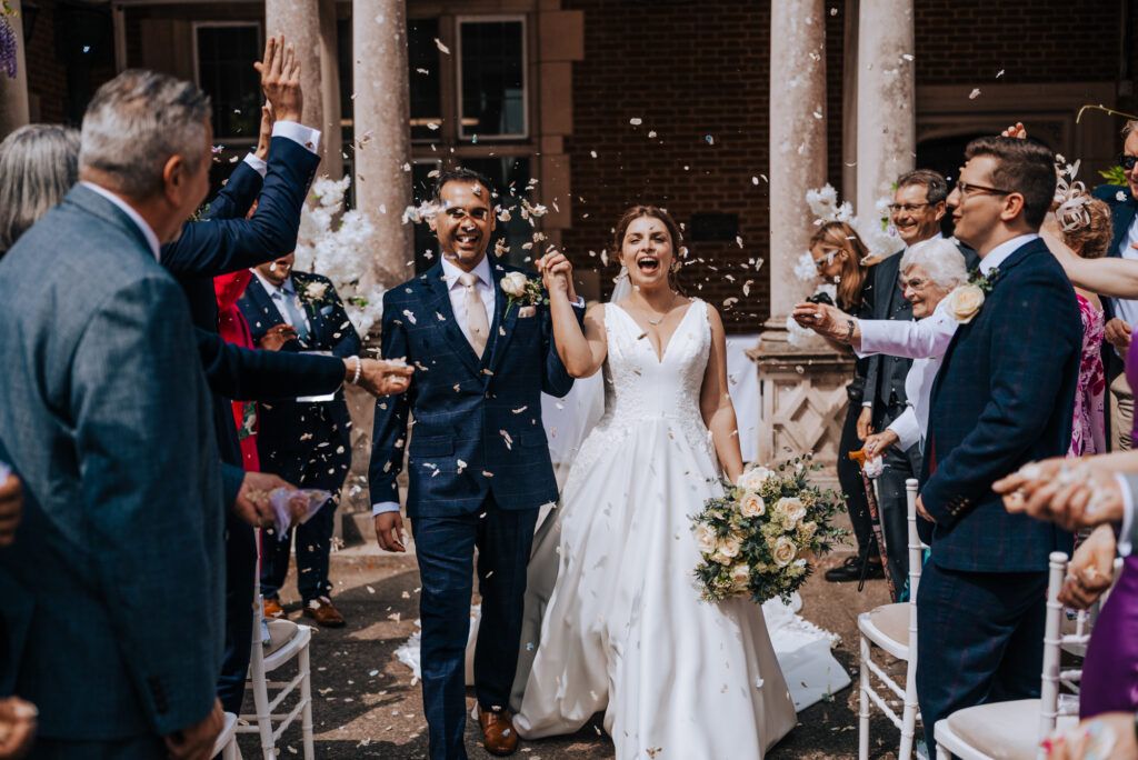 Guests enjoying drinks after a UK wedding ceremony