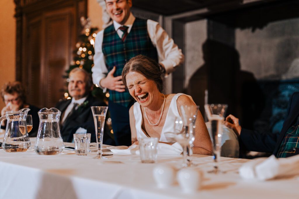 Bride reacting during wedding speeches at a UK wedding breakfast
