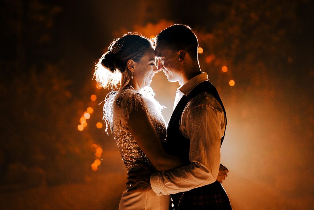 Bride and groom in romantic golden hour light, candid wedding photography in Sussex by Alex Buckland Photography