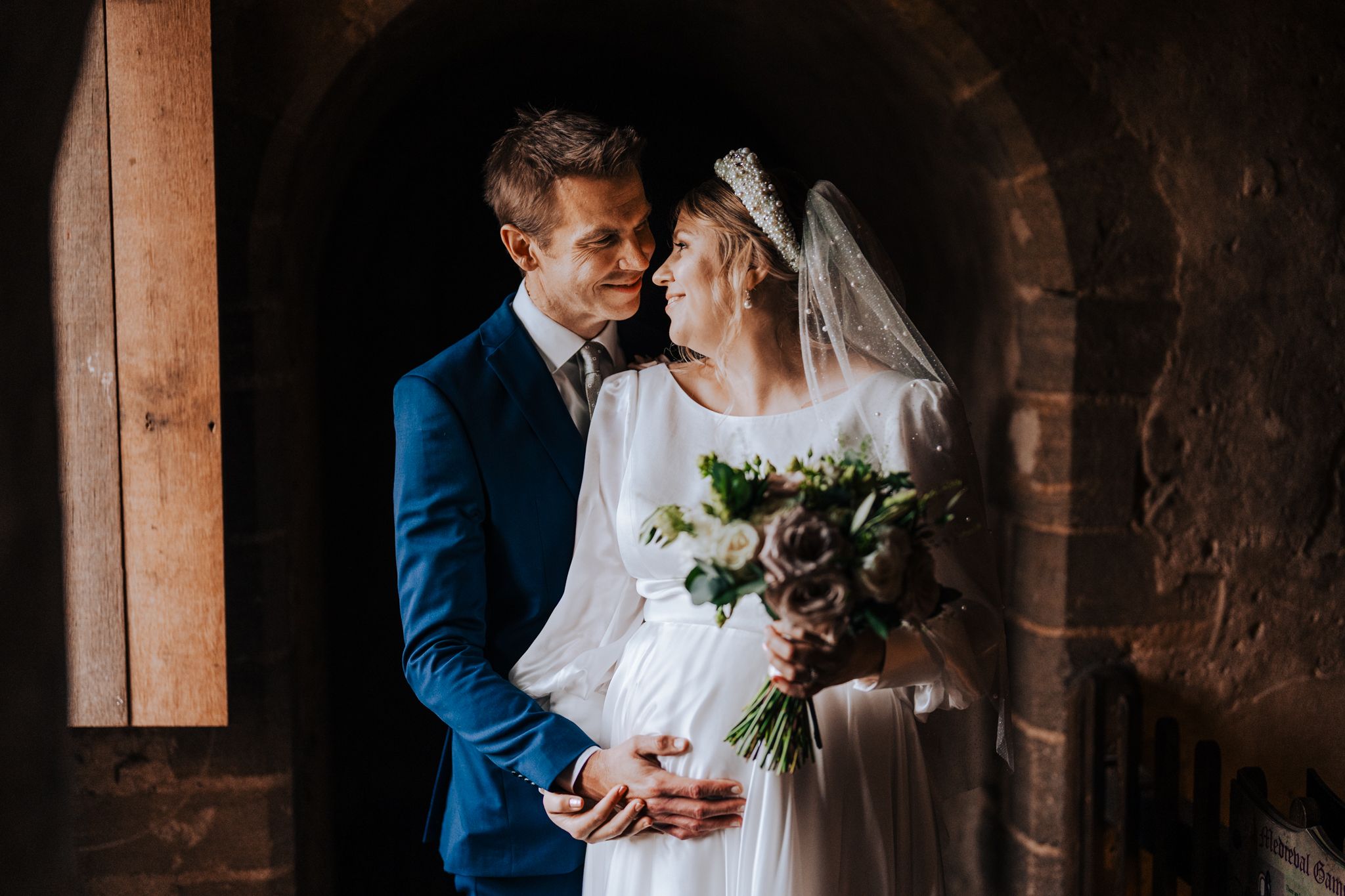 Cherie and Fraser on their wedding day at Hedingham Castle, Essex
